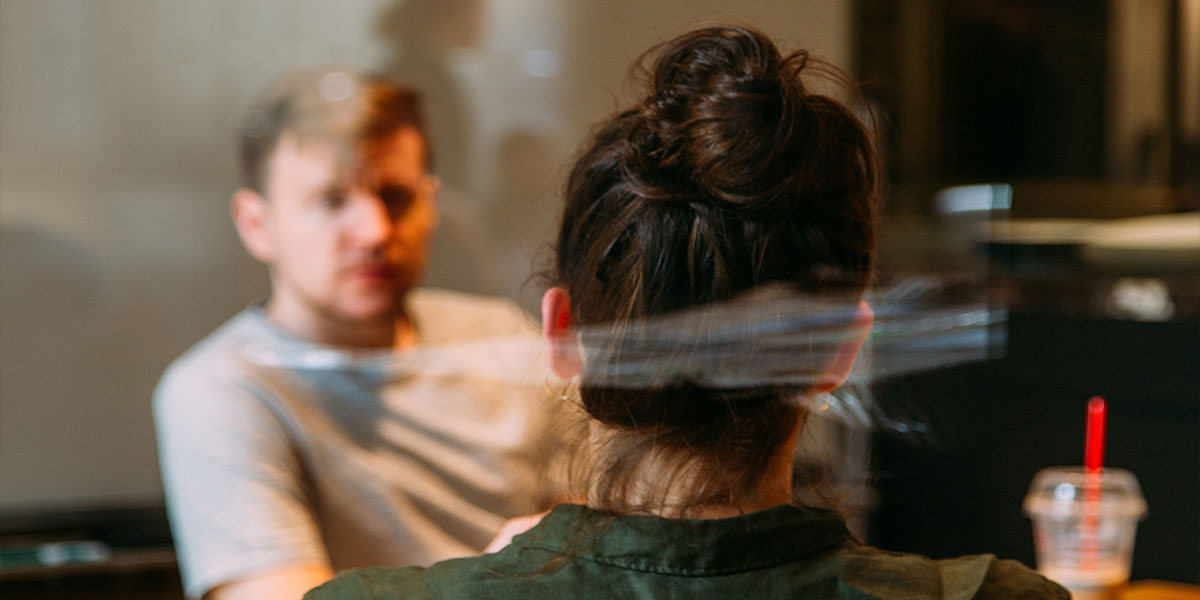 person sitting in a chair in front of a man
